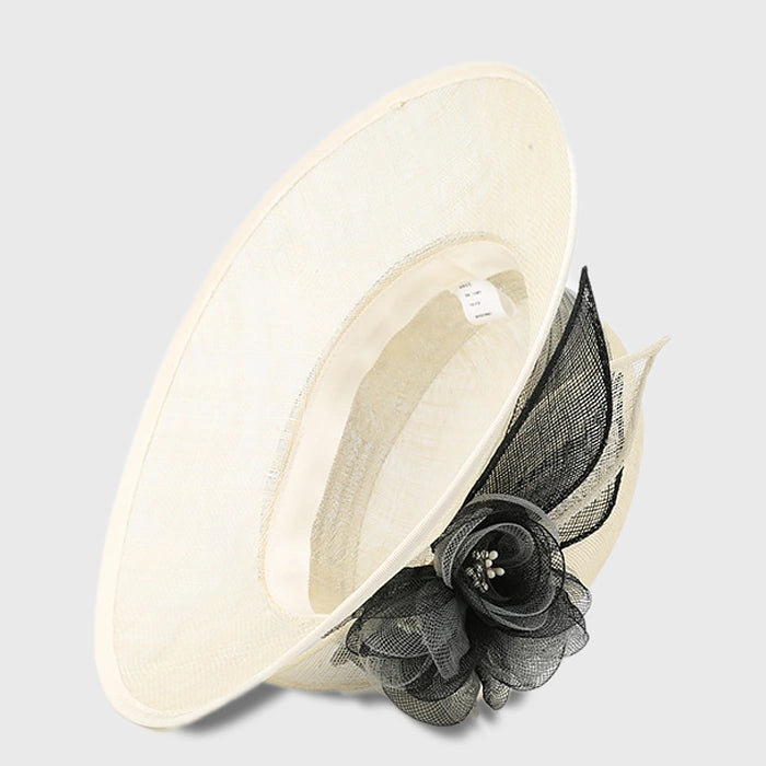 Sophisticated ivory cloche sinamay hat with black flower detail, perfect for weddings, afternoon teas, and galas.
