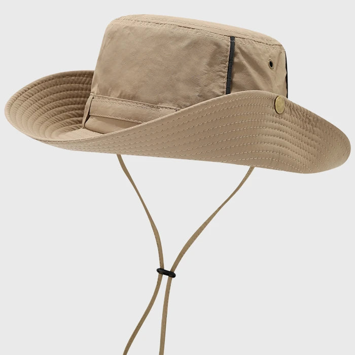 Khaki boonie hat with a wide brim and chin strap. Ideal for sun protection and comfort during outdoor activities like camping and hiking.