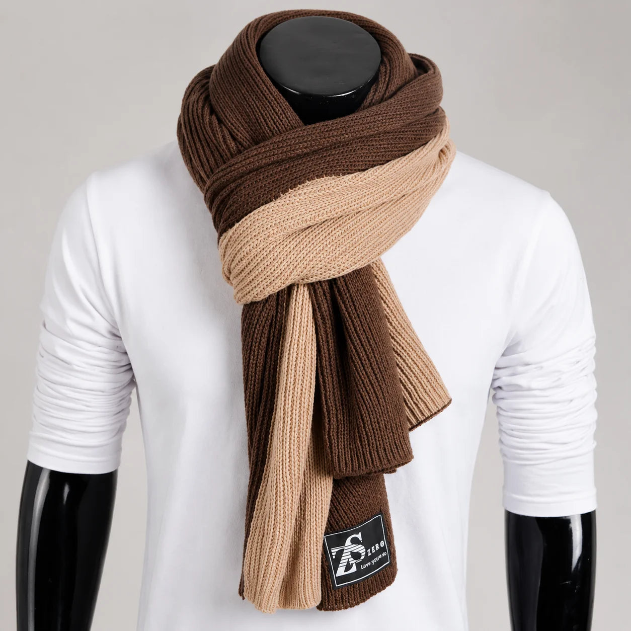 Dual-tone khaki brown melange knit scarf with soft ribbed texture, designed for modern urban winter layering and minimalist styling.