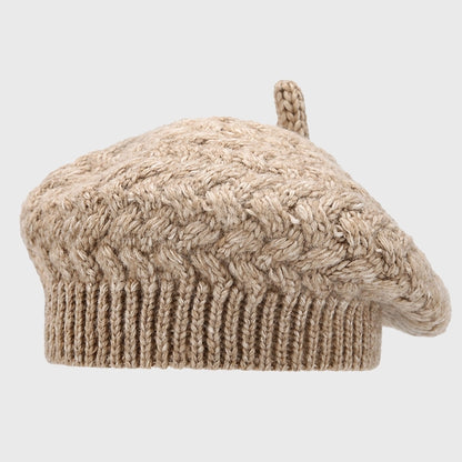 Khaki crochet cable knit beret, combining warmth and fashion. Adjustable size for comfort, perfect for chic winter styling.