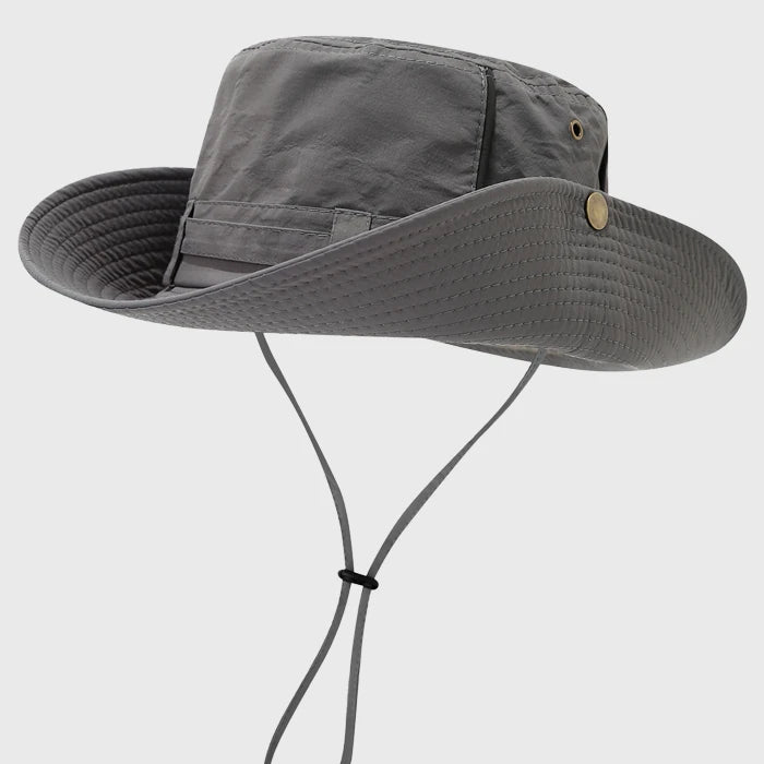 Light gray boonie hat with a packable design and adjustable chin strap. Provides excellent sun protection, perfect for outdoor adventures.