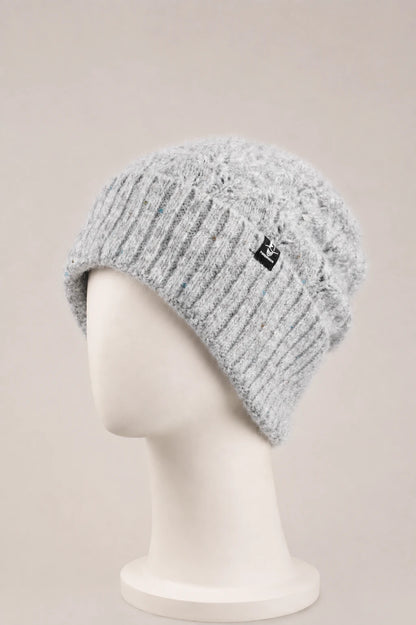 Light gray fuzzy sequin cuffed beanie displayed on a matte white mannequin.
