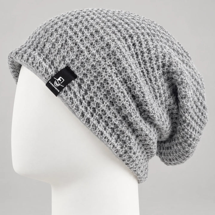 Light gray knit slouchy beanie with an open textured knit and relaxed fit