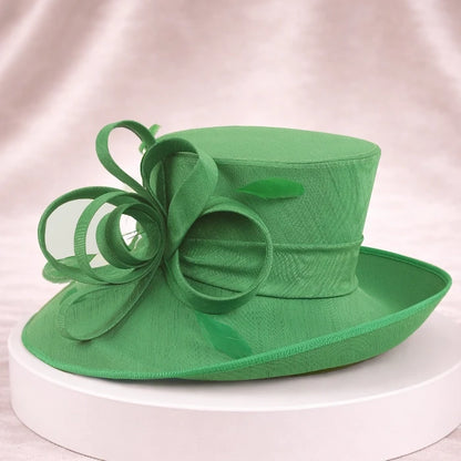Luxurious green church hat with floral ribbon decoration for women, ideal for church services, weddings, and garden parties