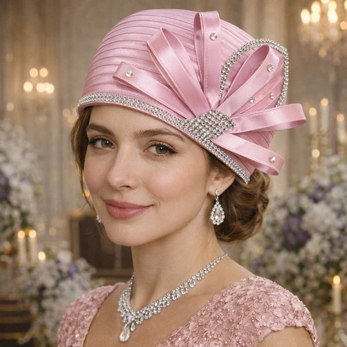 Luxury baby pink satin church hat with beautiful rhinestone details, great for formal events and church services.