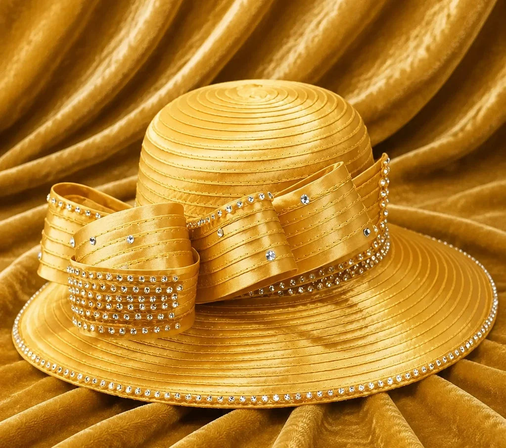 Luxury gold church hat with rhinestone trim and decorative bow displayed on velvet fabric background, ideal for Sunday worship and elegant occasions.