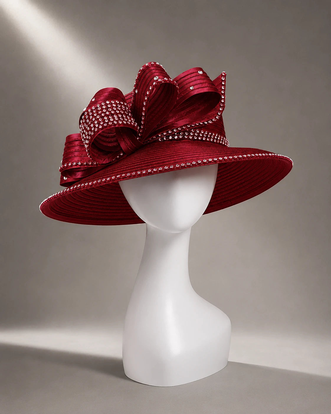 Luxury maroon wide brim church hat featuring sparkling rhinestones and bow accent, ideal for weddings, church, and fashion events.