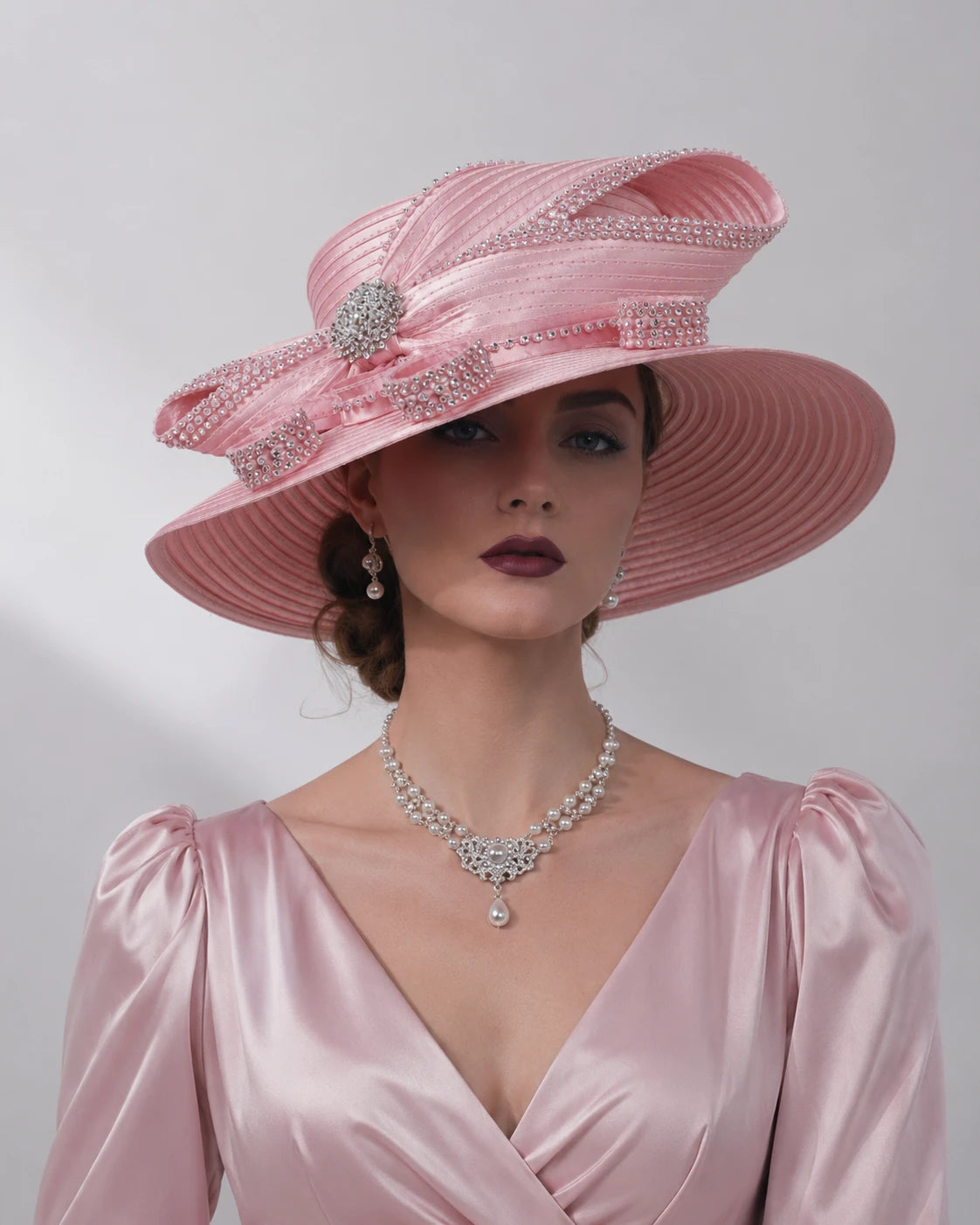 Luxury pink church hat for women with rhinestone trim and elegant wide brim design, styled for Sunday church and formal occasions
