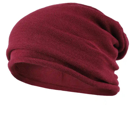 Maroon beanie hat for men and women, soft knit fabric, perfect for winter and spring, comfortable all-day wear, versatile casual accessory.