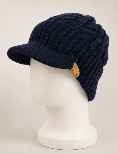 Navy blue cable knit visor beanie B5042 displayed on a white mannequin.