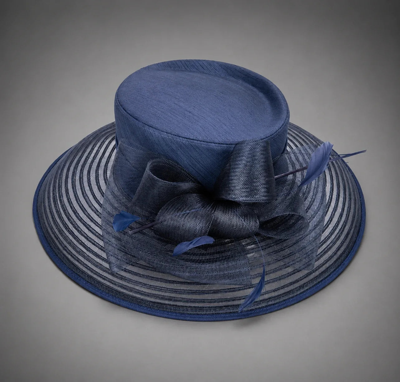 Navy blue church hat with mesh brim and feather bow for Sunday church service