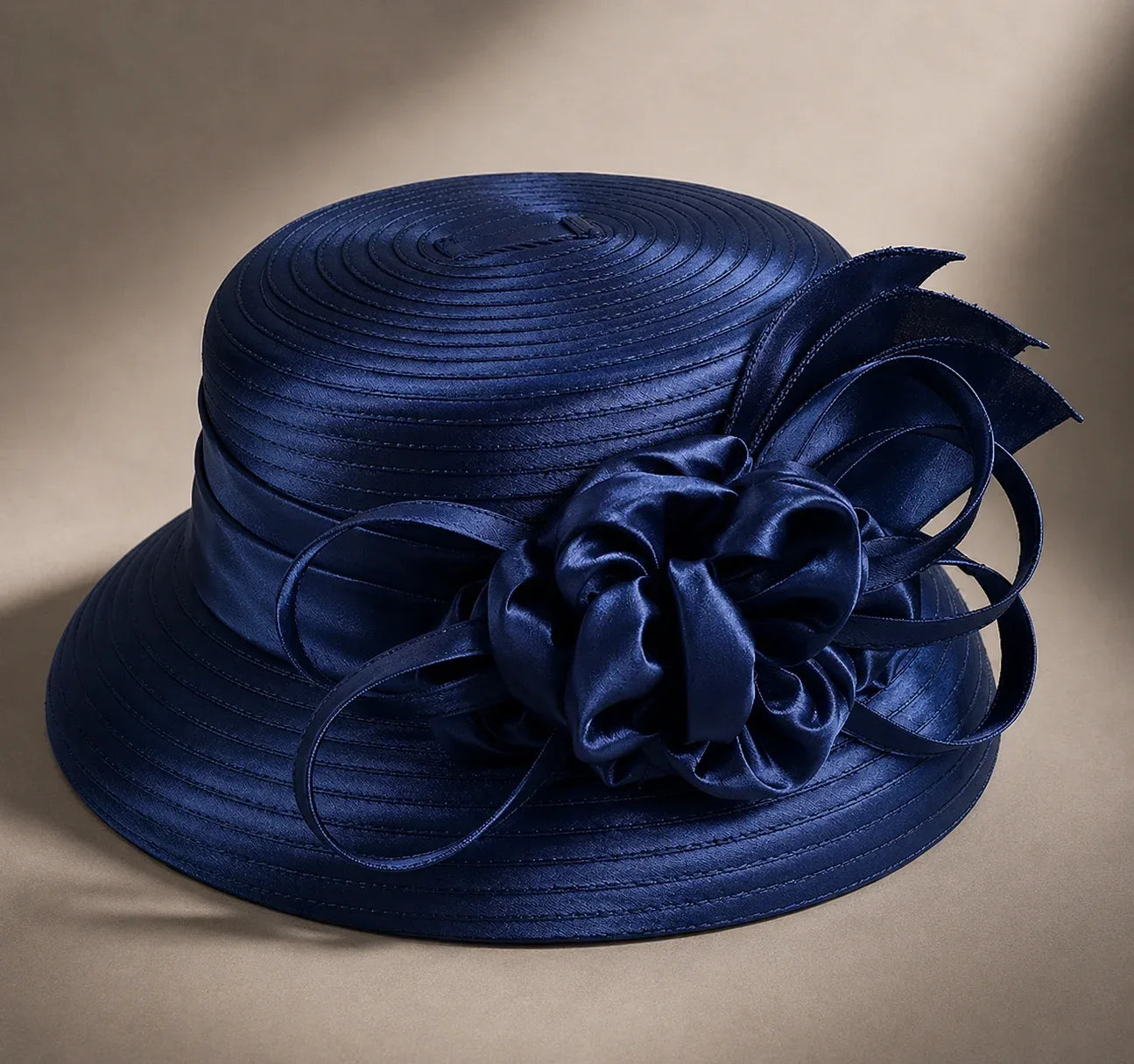 Flat lay of navy blue cloche short brim church hat with ribbon flower detail, elegant formal Sunday hat, FORBUSITE premium hat