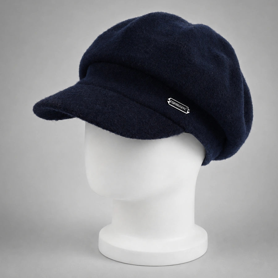 Navy blue women’s wool newsboy cap with short visor on mannequin