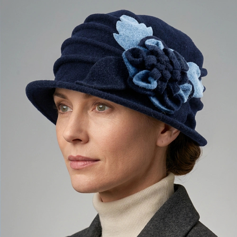 Side view of a navy floral cloche hat worn with a gray winter coat