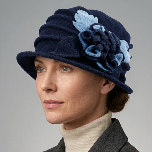 Side view of a navy floral cloche hat worn with a gray winter coat