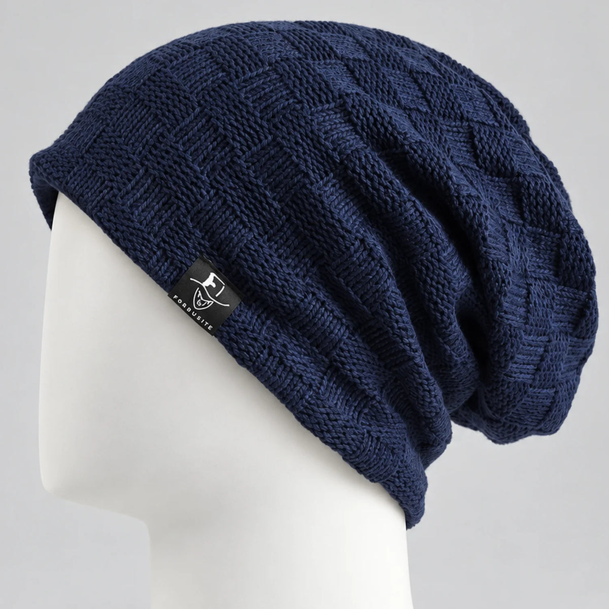 Navy textured knit slouchy beanie with a long relaxed crown
