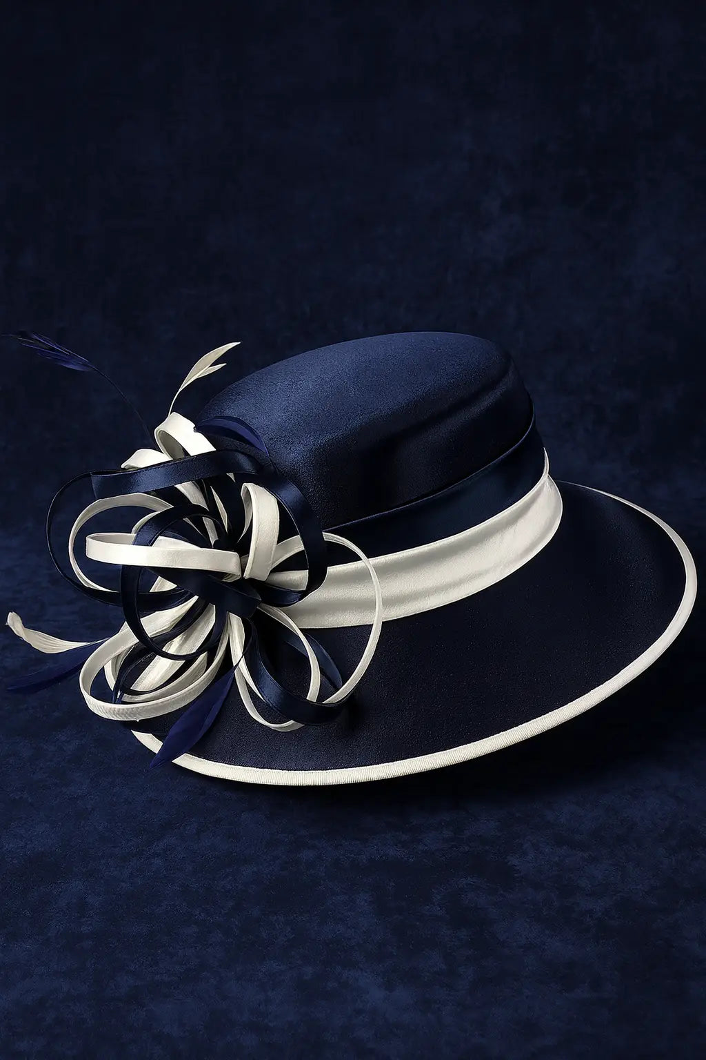 Side profile of a wide brim navy blue and white church hat adorned with curled satin ribbons and accent feathers, ideal for Sunday services or derby events.