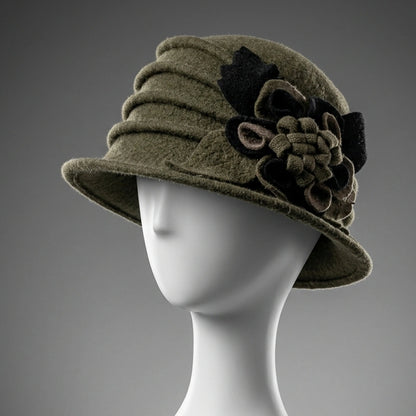 Olive green wool felt cloche hat with a fixed flower and leaf decoration