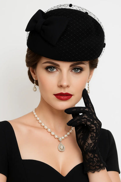 FORBUSITE black pillbox fascinator hat with bow and birdcage veil, model wearing church outfit