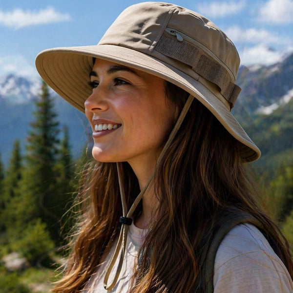 Outdoor adventure bucket hat with UPF50 protection, featuring a zipper side pocket and adjustable chin strap. Ideal for hiking, camping, and other outdoor activities.