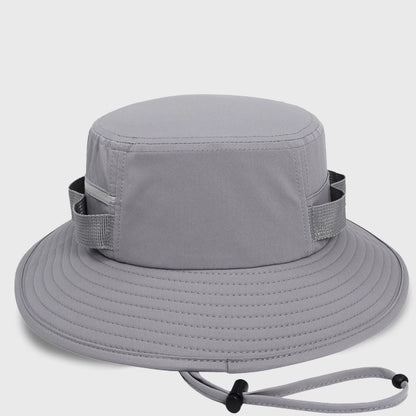 Gray outdoor adventure sun hat with UPF50 protection, a versatile bucket hat for both men and women, designed with a drawstring and zipper pockets for convenience.