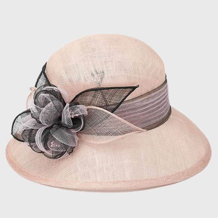 Elegant peach cloche sinamay hat with black flower accent, perfect for weddings, tea parties, and formal events.