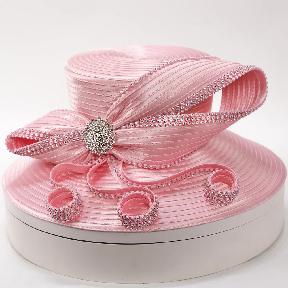 Elegant pink wide-brim church hat with rhinestone trim and sculpted ribbon