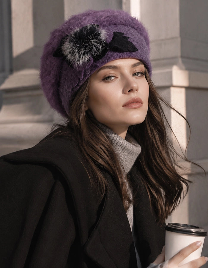 Purple angora wool beret with flower accent styled with black coat for winter