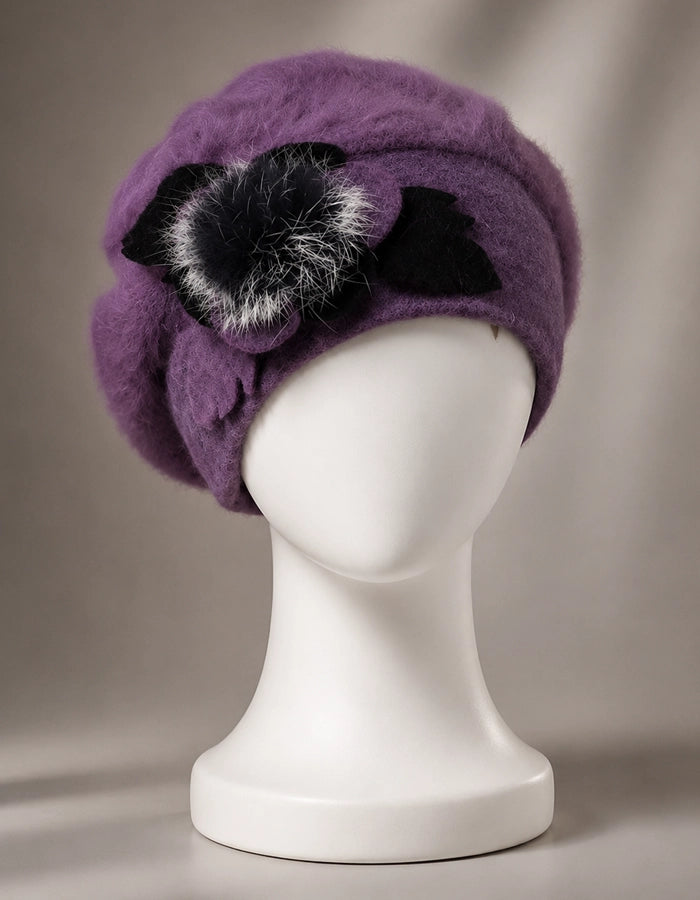 Purple angora wool beret with black flower accent for elegant winter styling