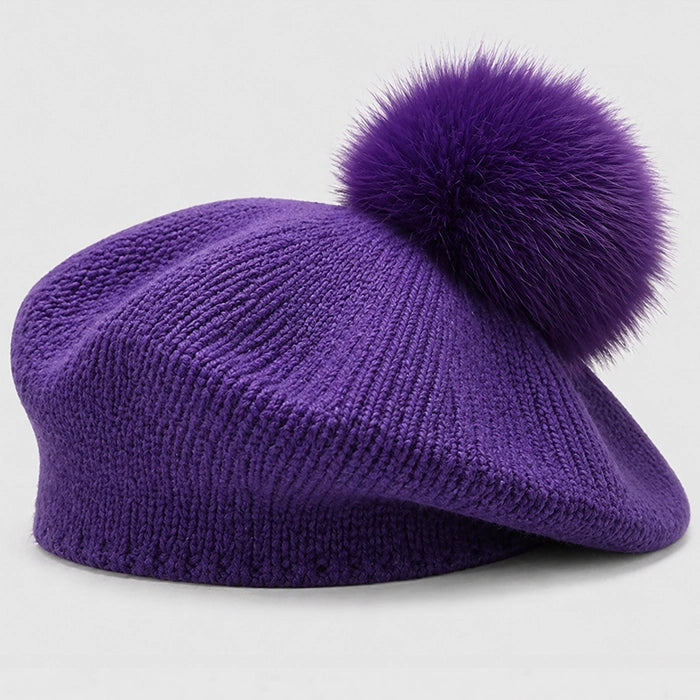 Purple beret with pom-pom, adding a bold and cozy touch to your winter fashion.