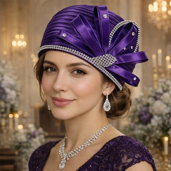 Elegant purple satin church hat with crystal details, perfect for weddings and formal events.