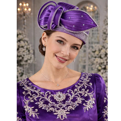 Close-up of a luxurious purple satin church hat with intricate floral design and crystals.