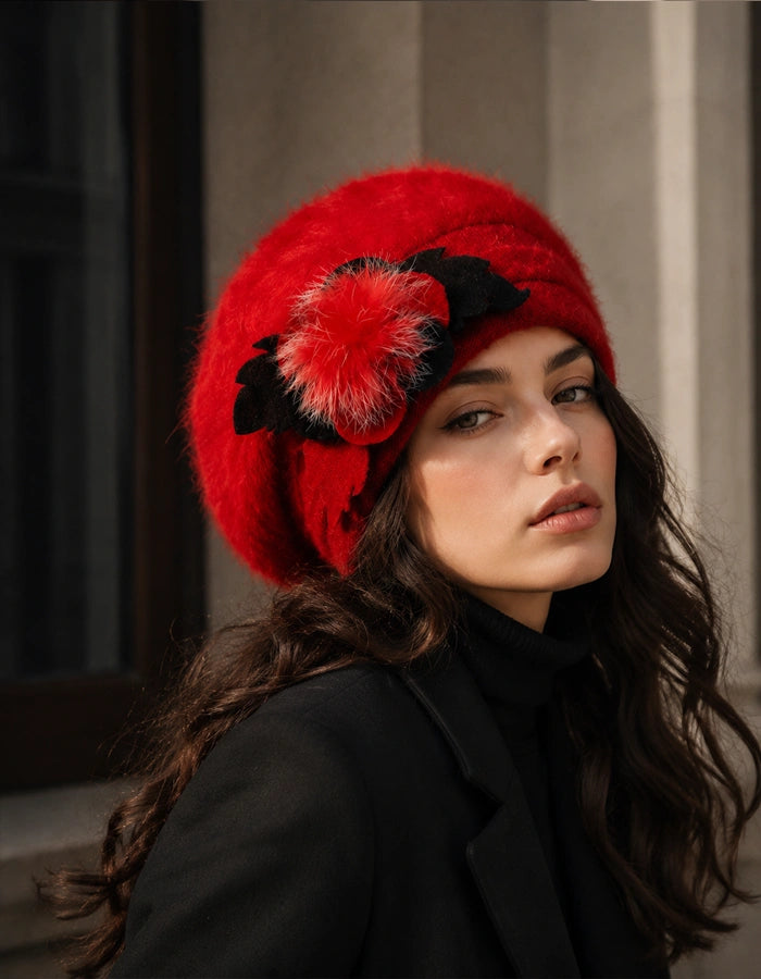 Red angora wool beret with flower accent styled with black winter coat for women