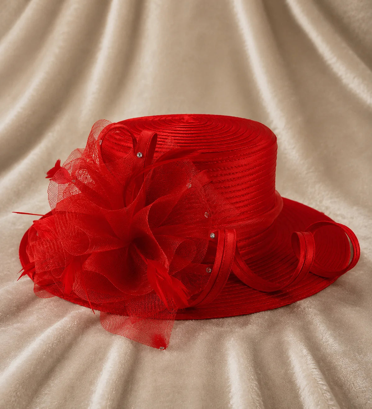 Front view of red church hat on African American fashion model, adorned with netting and rhinestones, luxurious formal hat for weddings and church services