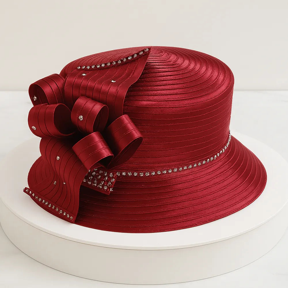 Elegant claret church hat with rhinestone bow detail on white turntable, perfect for women’s Sunday service or formal events