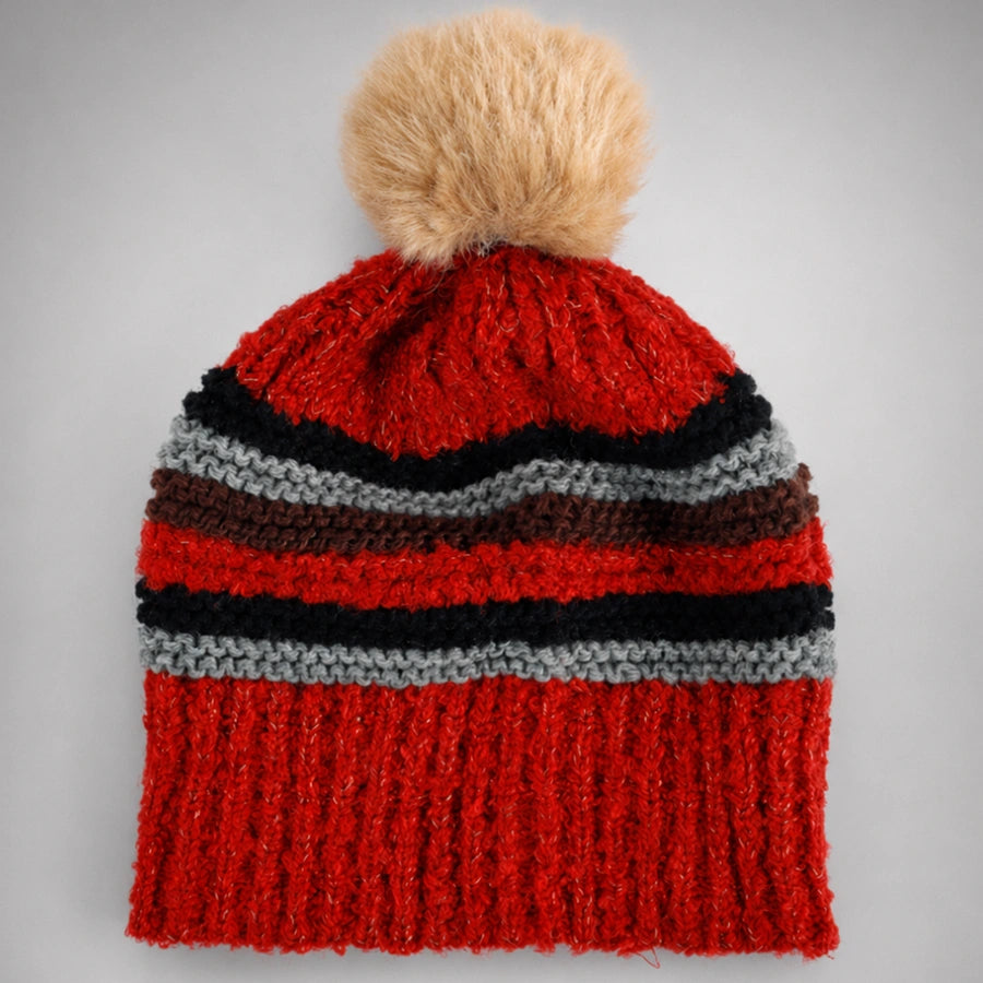 Red striped pom pom beanie flat lay with fixed faux fur pom