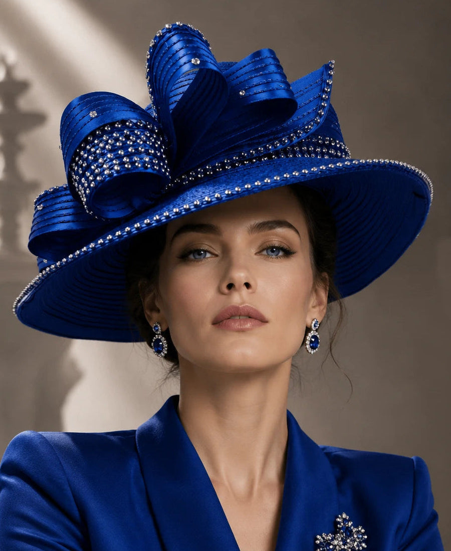 Elegant woman wearing a royal blue church hat with rhinestone trim and decorative bow, ideal for Sunday worship, Easter services and formal church occasions.