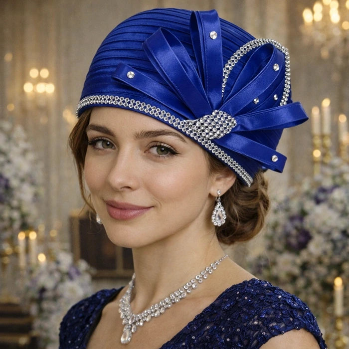 Royal blue satin church hat with rhinestone embellishments and satin bow, perfect for formal gatherings and weddings.