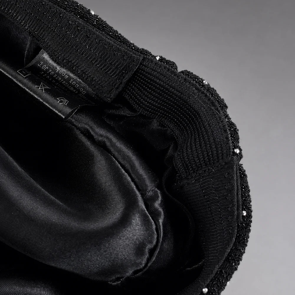 Inside view of ruched visor cap showing satin lining and adjustable elastic back