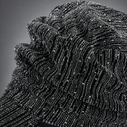 Close-up of textured ruched visor cap fabric with glued rhinestone decoration
