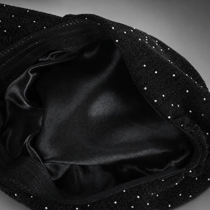 Interior of women’s ruched visor cap showing smooth black satin lining