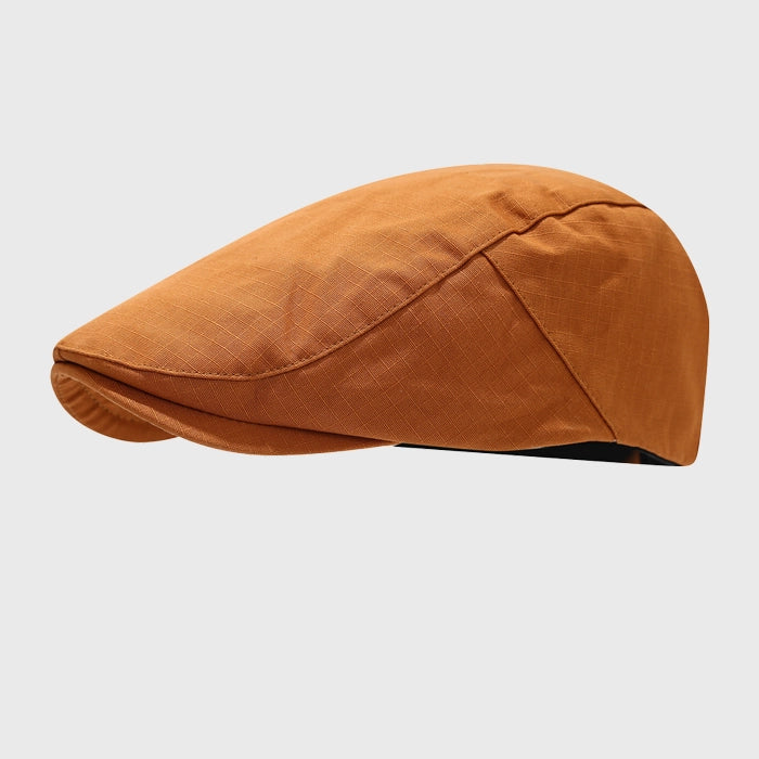 Rust flat cap, adjustable fit for casual wear with a vintage style. A great addition to your everyday wardrobe.