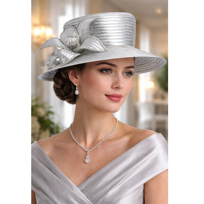 Graceful silver church hat adorned with a flower detail and crystal embellishments, ideal for formal events, weddings, and social gatherings.