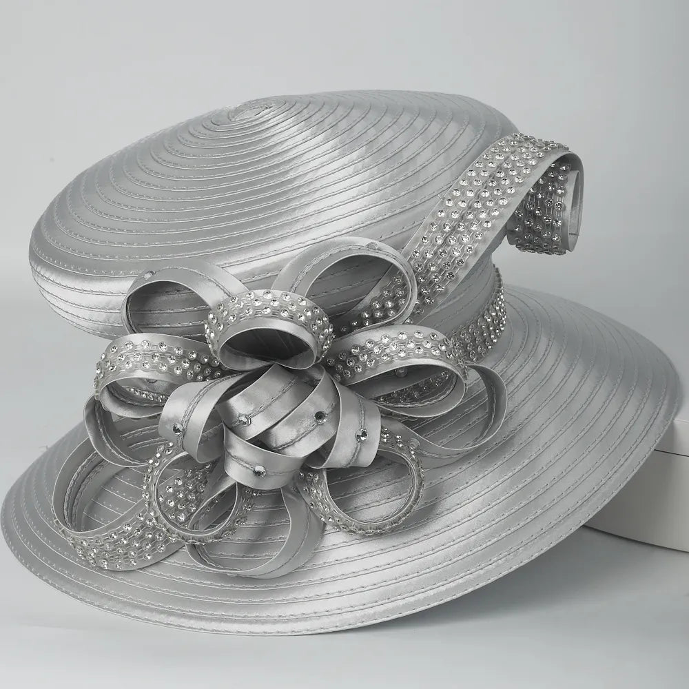 Side view of silver satin church hat with sparkling rhinestone flower detail, ideal for formal church events.
