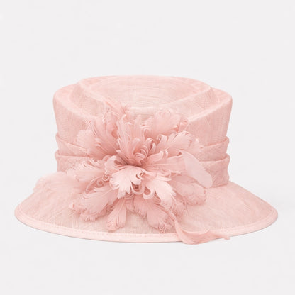 Light pink sinamay hat featuring elegant feather flowers, ideal for garden parties or upscale events.