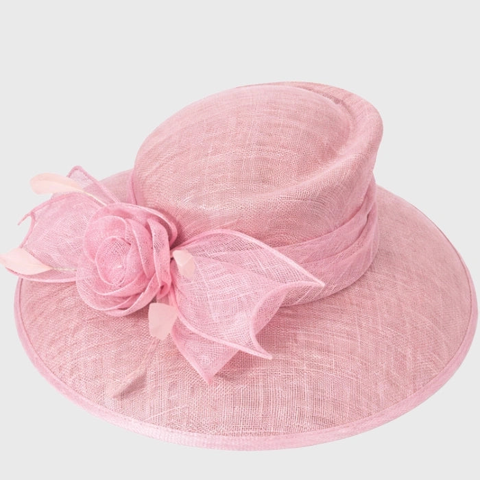 Soft pink sinamay hat with floral rose accent, a sophisticated accessory for weddings, tea parties, and afternoon events.