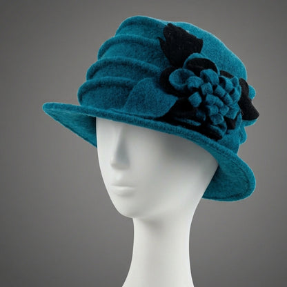 Teal wool felt cloche hat with black and teal floral side detail
