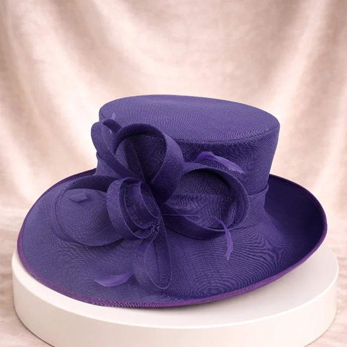 Top view of a purple hat with ribbon detail, perfect for wedding and garden party outfits.