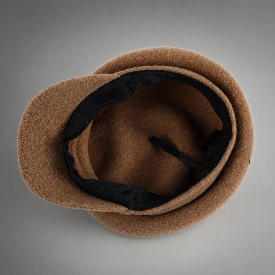 Interior of unlined wool newsboy cap with black adjustable sweatband