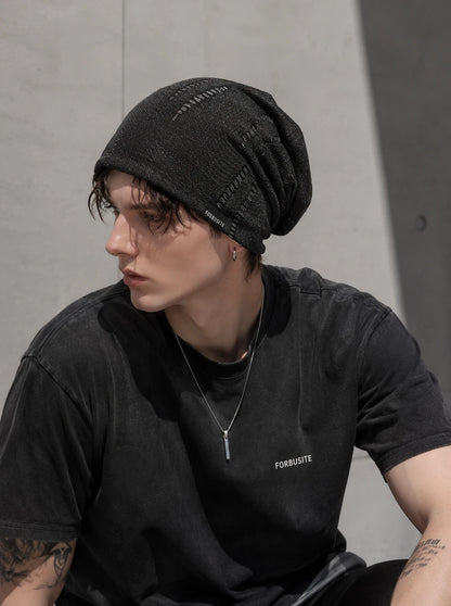 Urban style black slouch beanie for men paired with casual oversized t shirt in modern streetwear outfit
